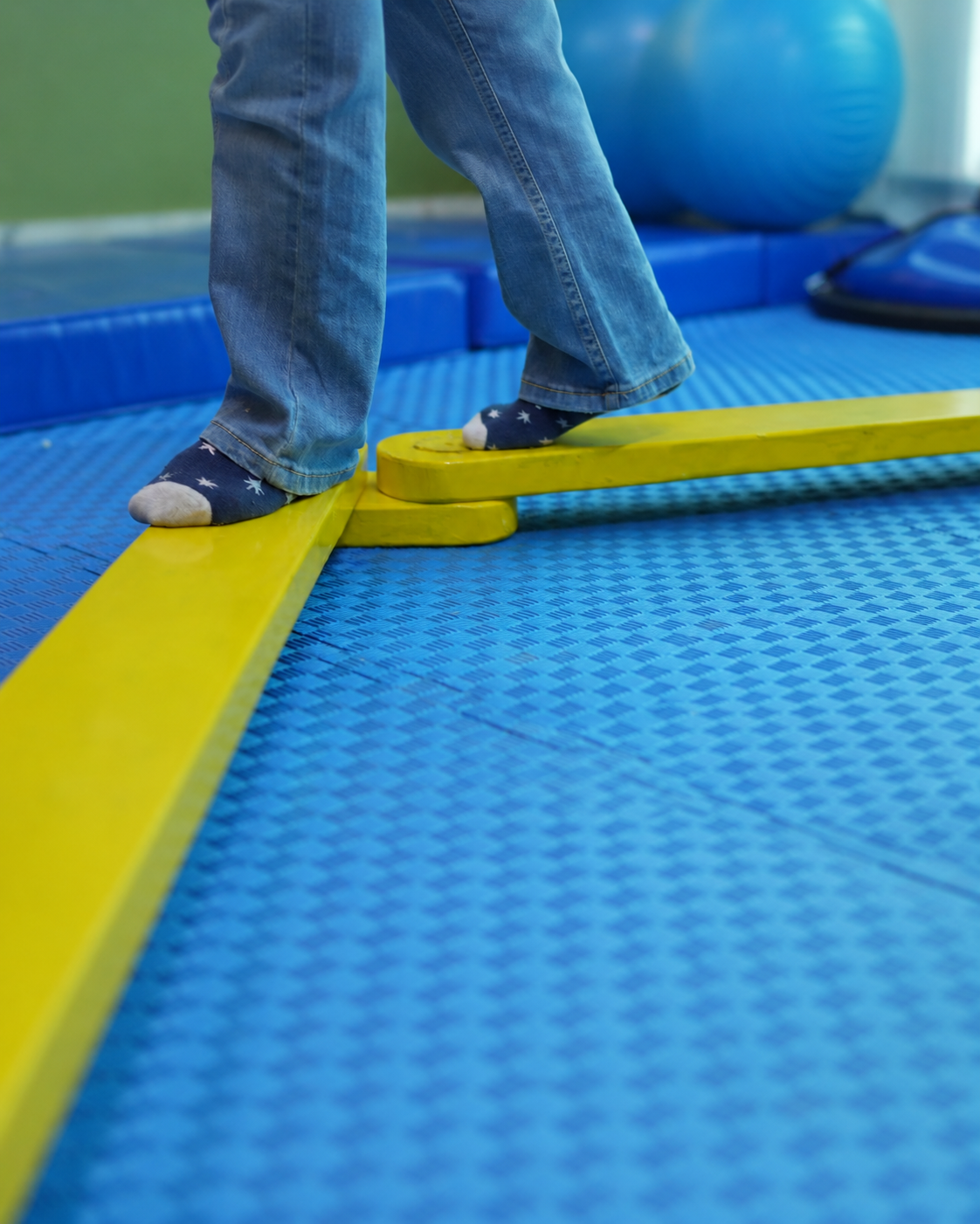 Therapist guiding a child through sensory play at The Milestone Centre